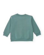 Sweatshirt arkadan; baskısız düz çağla yeşili gövde, ribanalı kol uçları ve etek ucu görünüyor.