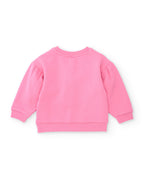 Zürafa baskılı pembe sweatshirtin düz arkası; balon kollar ve ribana etek ucu net seçiliyor.