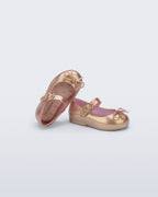 Vegan Melflex dokulu Mini Melissa Sweet Love gold pembe çocuk babeti çapraz açı görünümü