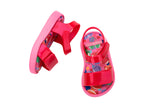 Mini Melissa pembe bebek sandaleti üstten görünüm, renkli vişne desenleri ve güvenli bant detayı