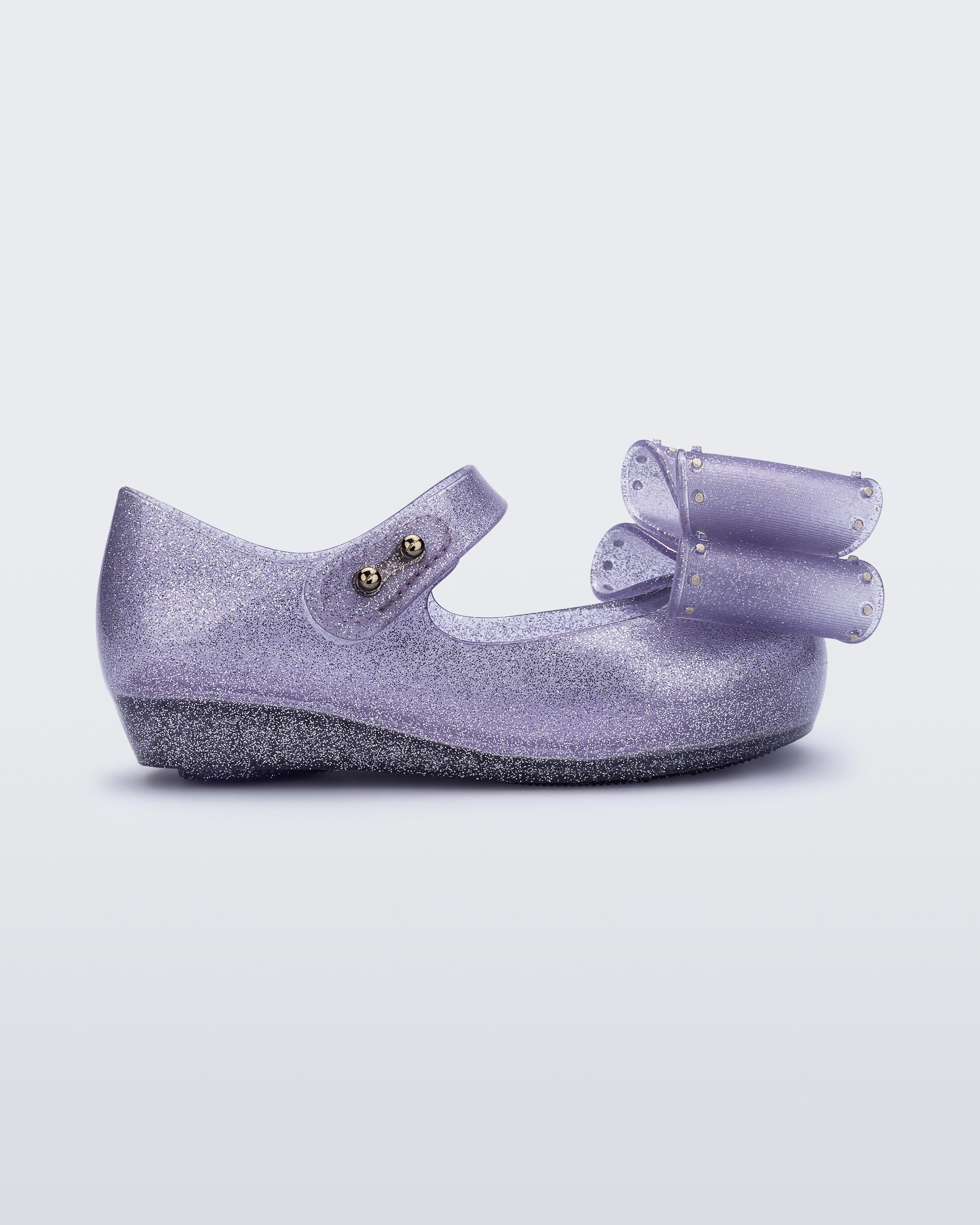 Mini Melissa Ultragirl Classic Bow simli lila fiyonklu kız çocuk babeti önden yan görünüm esnek Melflex vegan materyal