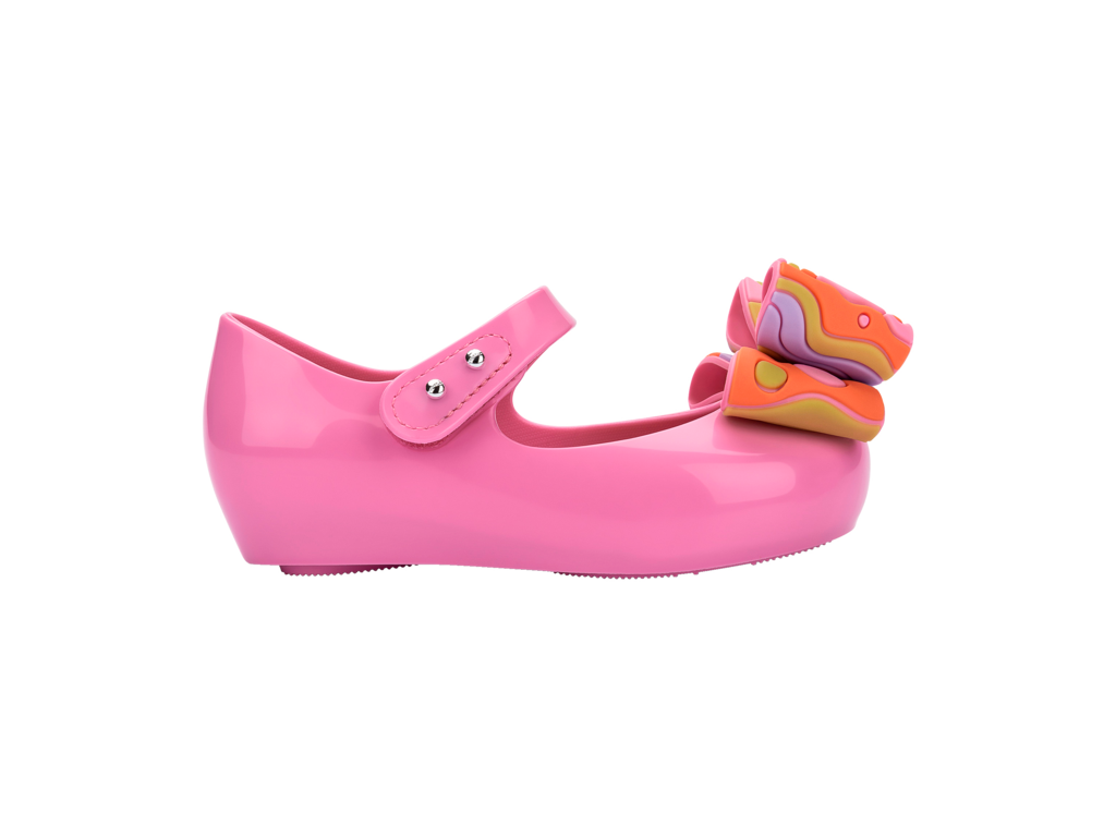 Mini Melissa Ultragirl Wonderland BB pembe çocuk ayakkabı – sağ yan görünüm, turuncu renkli fiyonk süslemeli, esnek ve rahat yapı
