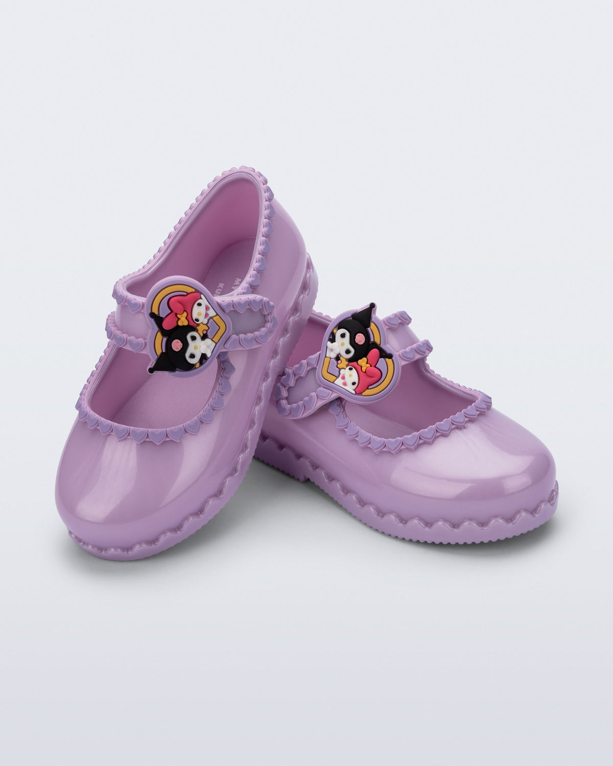 Lila Mini Melissa Hip Ballerina çifti üstten açıyla; dalgalı kalp kenar süsü net görünüyor.