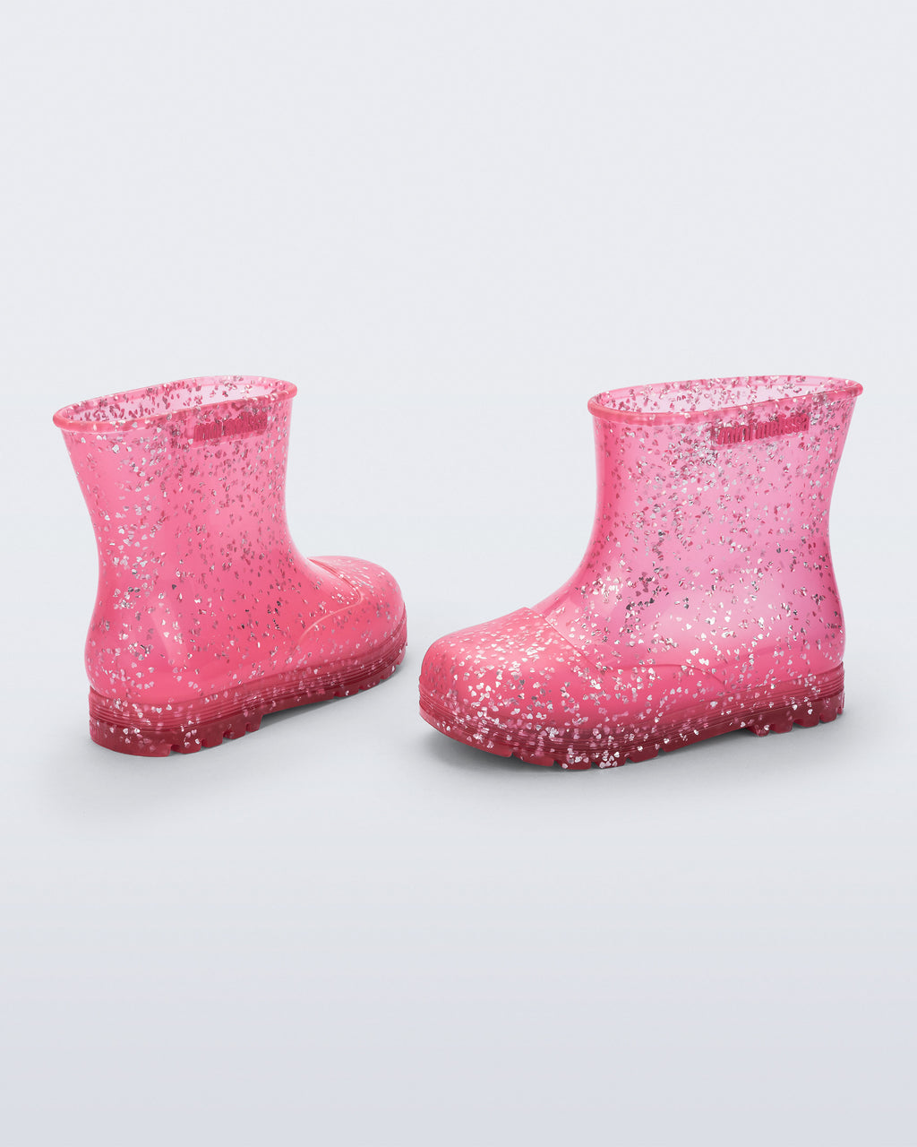 Şeffaf pembe Mini Melissa Welly Shiny çifti üstten açıyla; simli kalp parçacıkları net görünüyor.