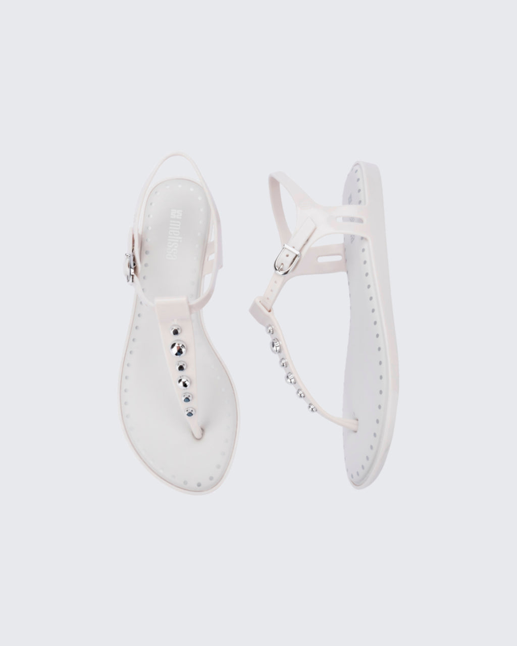 Yumuşak iç tabanlı ve metalik düğme detaylı Melissa Solar Boho beyaz kadın parmak arası sandalet üstten görünüm