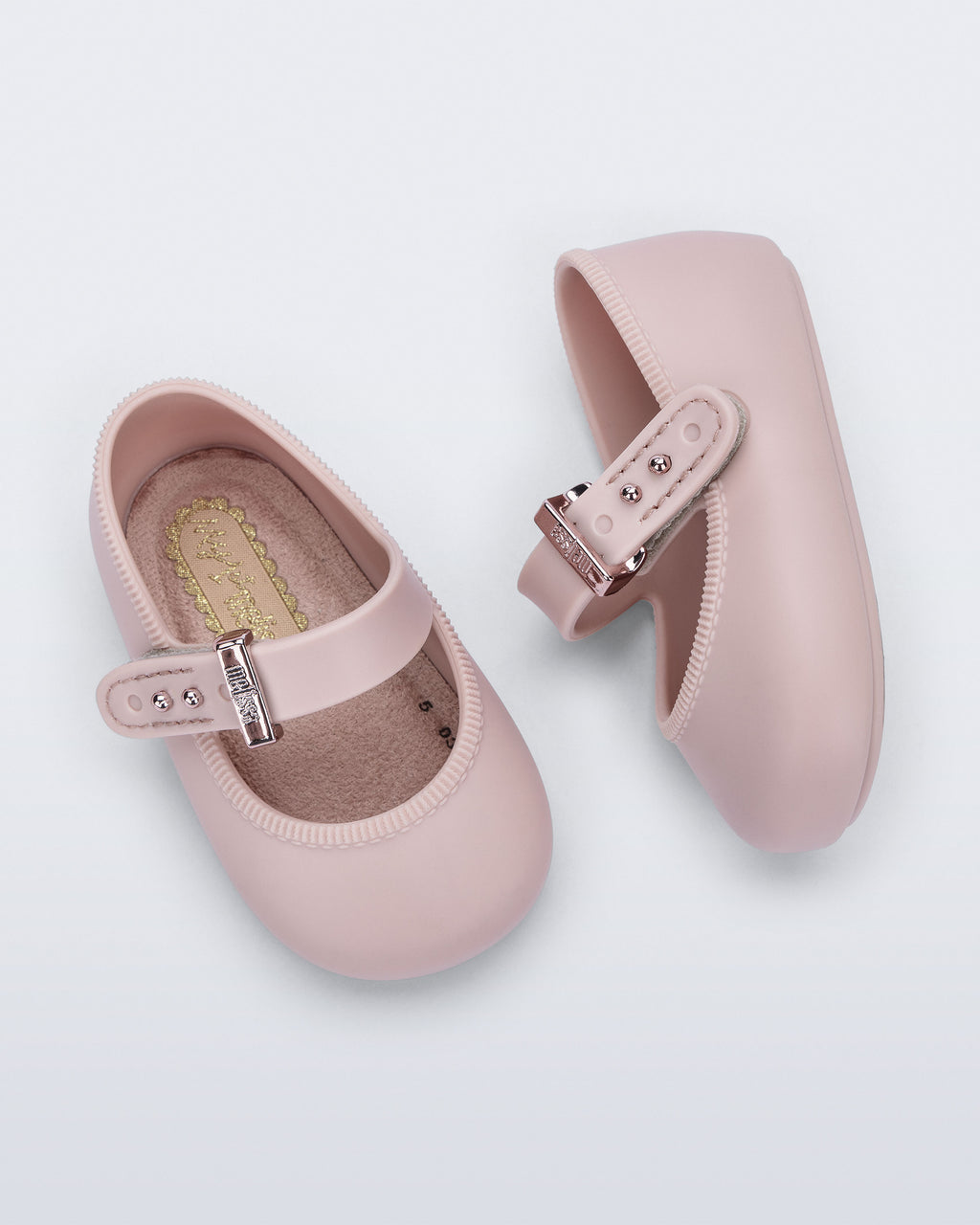 Mini Melissa pudra pembe bebek babeti üstten görünüm, peluş kaplı yumuşak iç taban