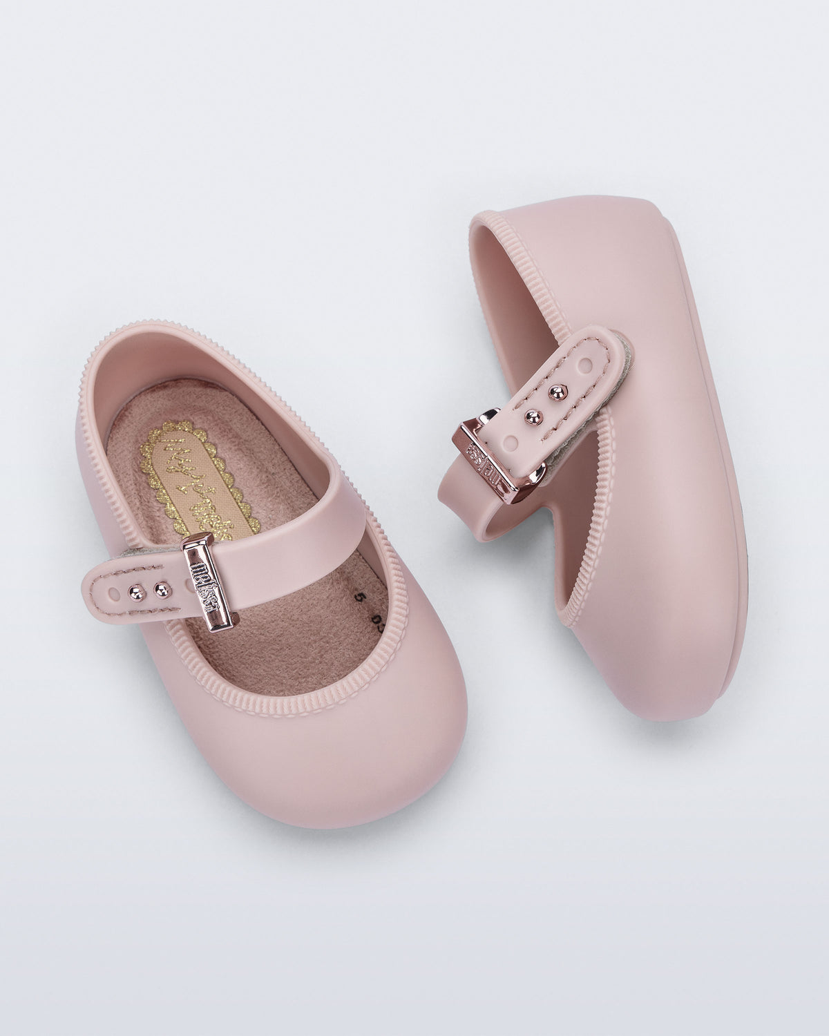 Mini Melissa pudra pembe bebek babeti üstten görünüm, peluş kaplı yumuşak iç taban