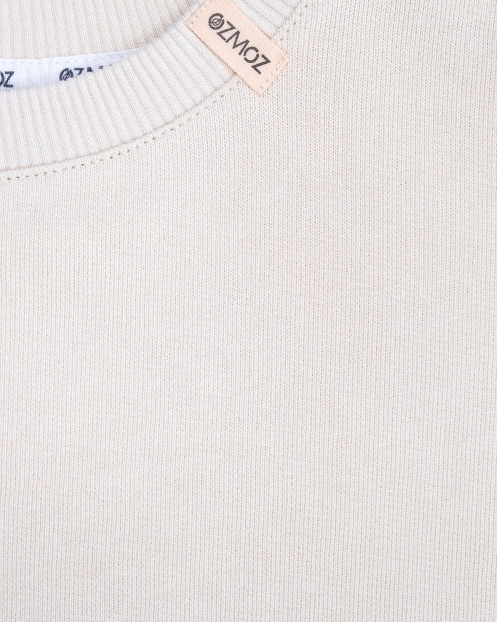 Kışlık kalın 3 iplik interlock örgü kumaş tekniğiyle üretilmiş bej organik takım dokusu