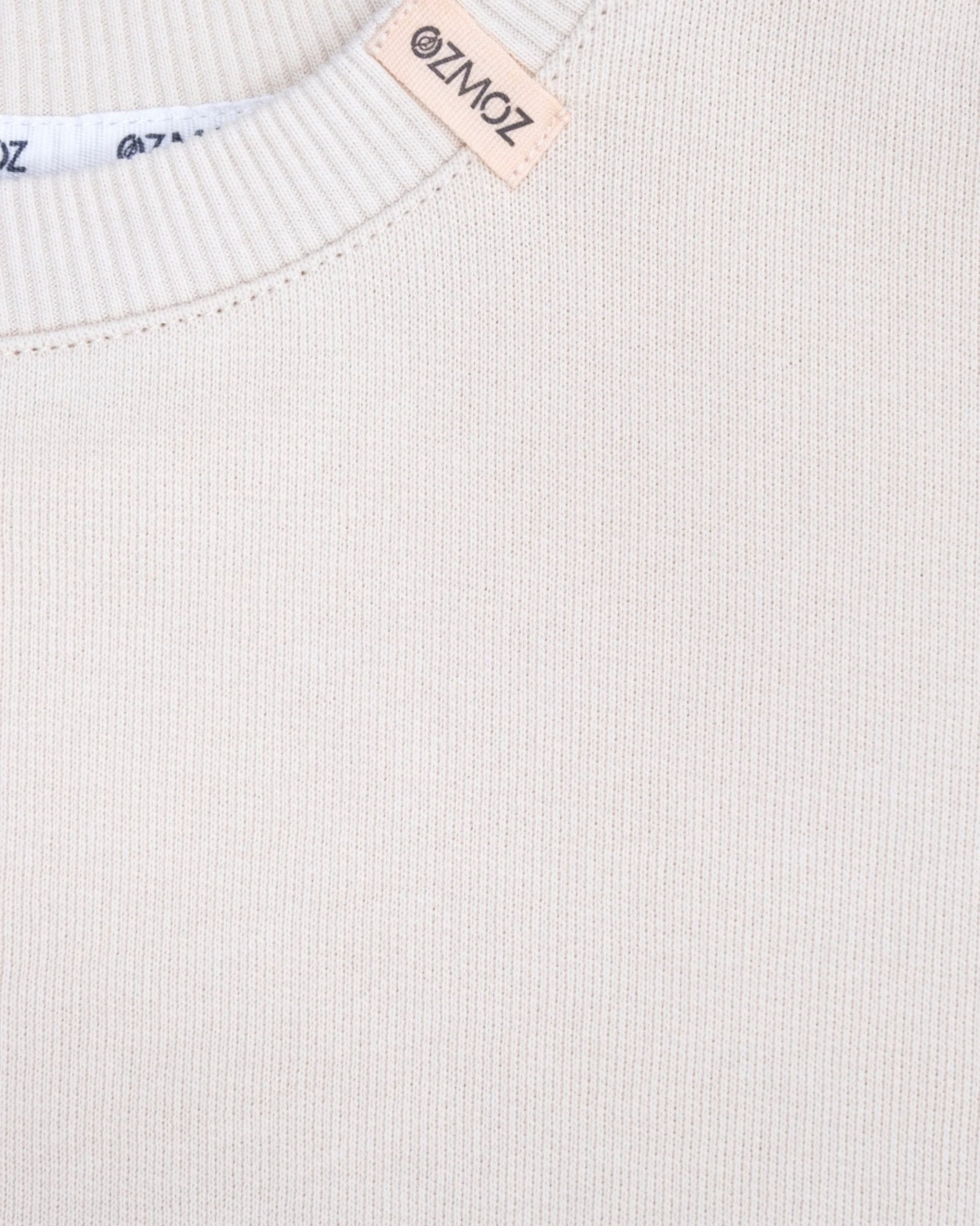 Kışlık kalın 3 iplik interlock örgü kumaş tekniğiyle üretilmiş bej organik takım dokusu